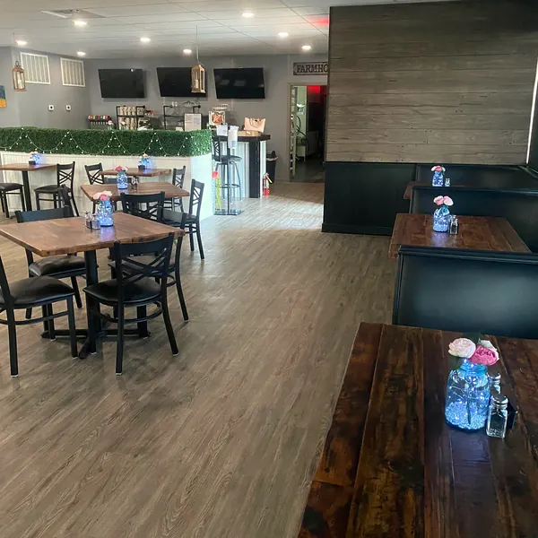 Booths and tables along the windows in the dining room