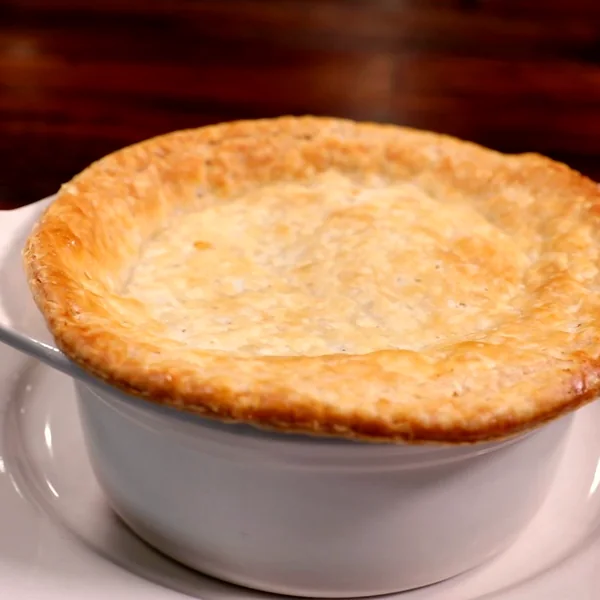 A chicken pot pie with a golden, flaky crust